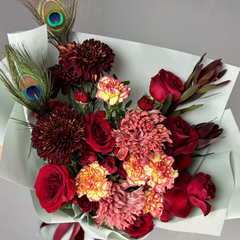 Bouquet of flowers with a peacock feather 