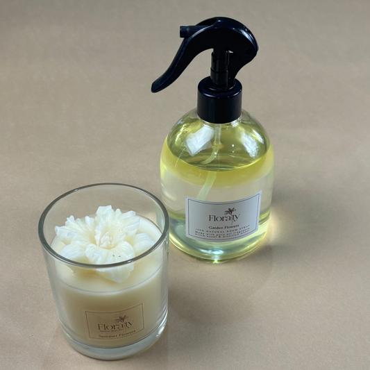Candle and spray bottle with 'Bogey' label on a beige background