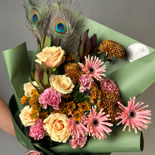 Bouquet of flowers with peacock feathers
