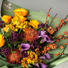 Bouquet of flowers with green wrap on a neutral background