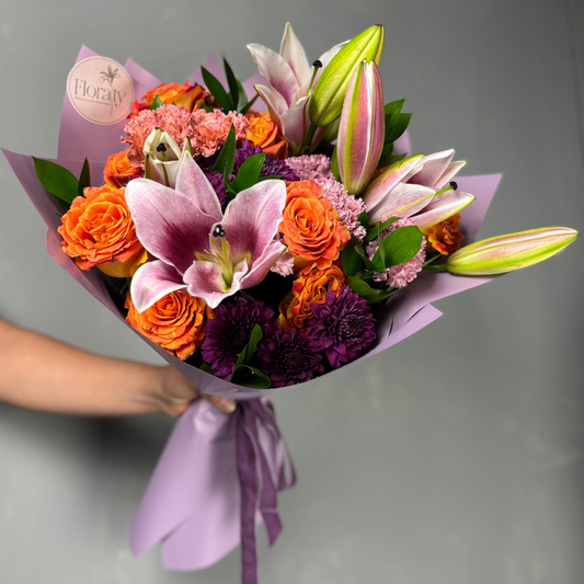 Bouquet of pink lillies and orange roses colors 